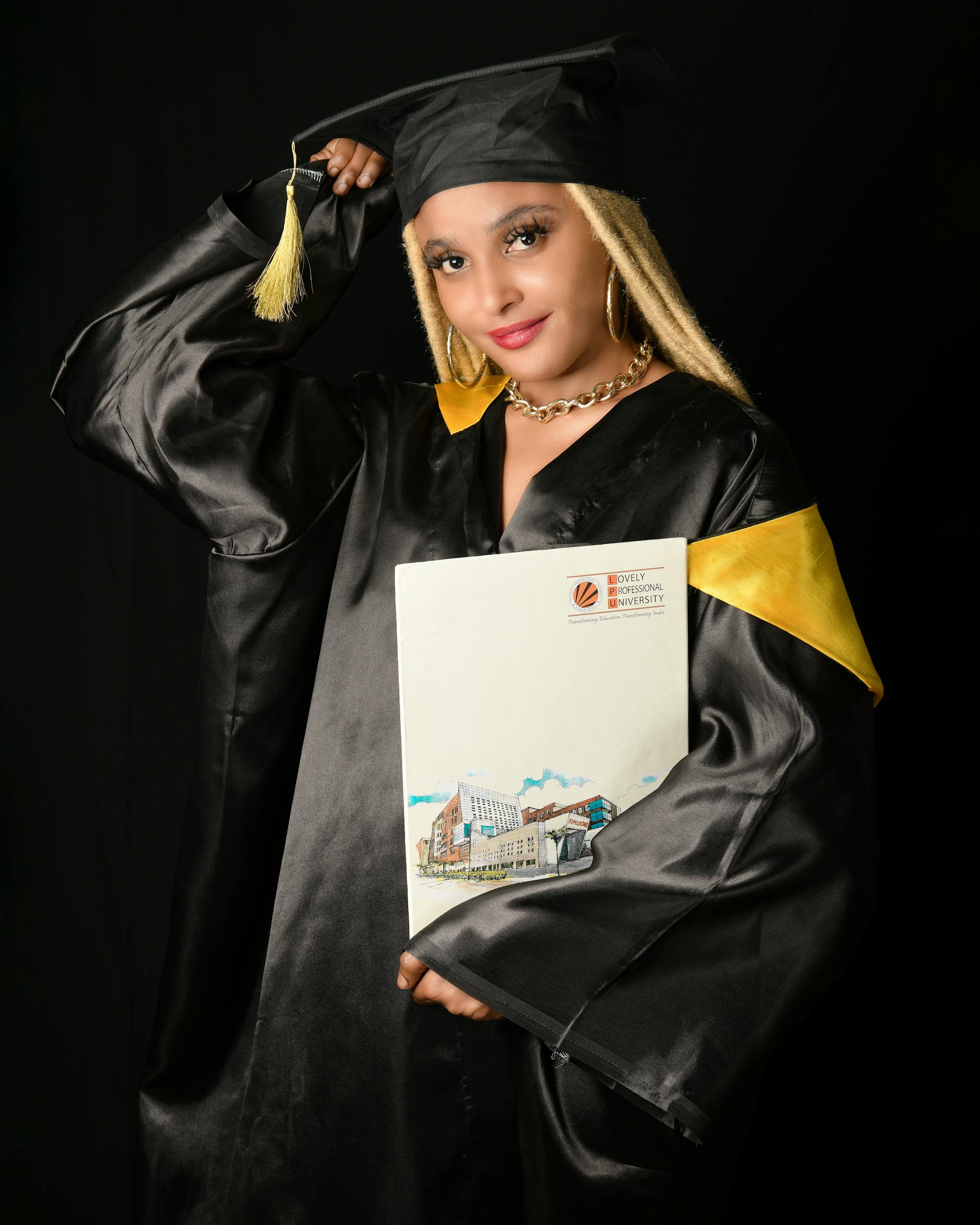 Woman in Gown Posing with Thesis